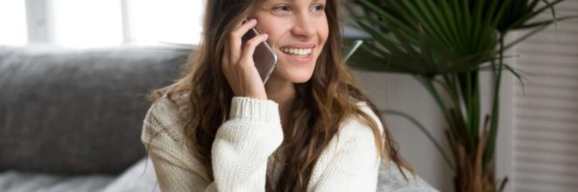 Woman smiling on the phone
